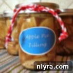 Side view of Apple Pie filling in a glass jar