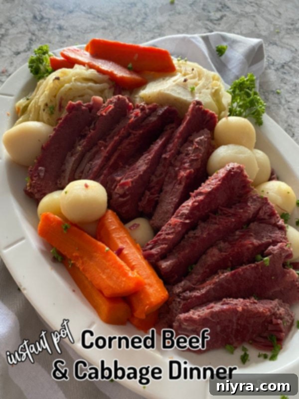 Instant Pot Corned Beef and Cabbage Dinner on a white plate
