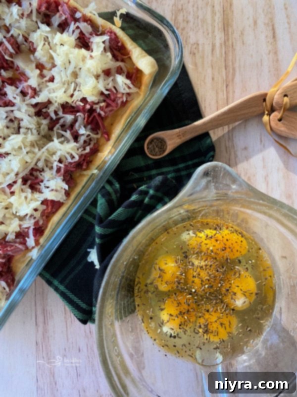 Pouring egg mixture over Reuben casserole ingredients