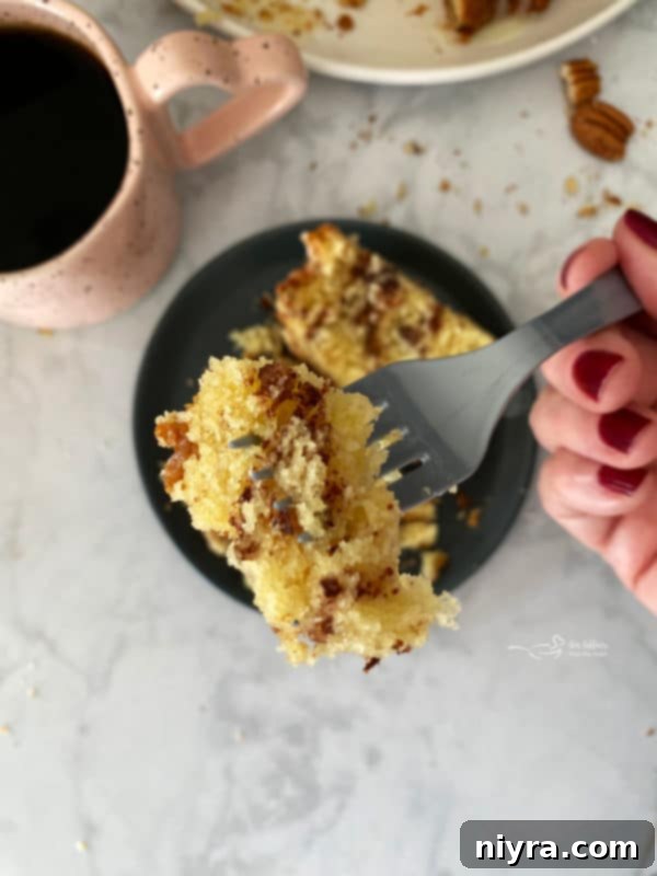 Enjoying a slice of Sour Cream Coffee Cake with coffee
