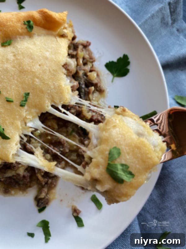 Swiss Mushroom Runza Bake 11 Cooked Swiss Cheese Mushroom Runza Casserole in a glass baking dish, ready to be served.