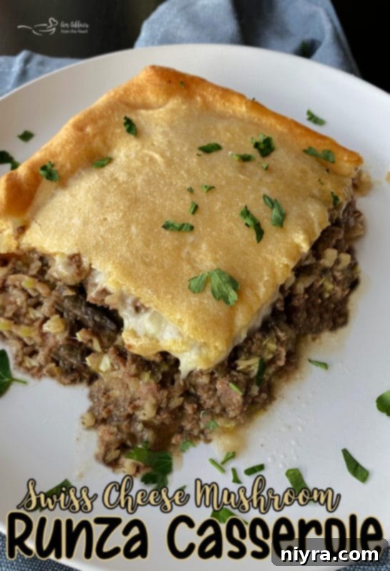 Swiss Mushroom Runza Bake 17 A slice of Swiss Cheese Mushroom Runza Casserole on a plate, showing the layers.