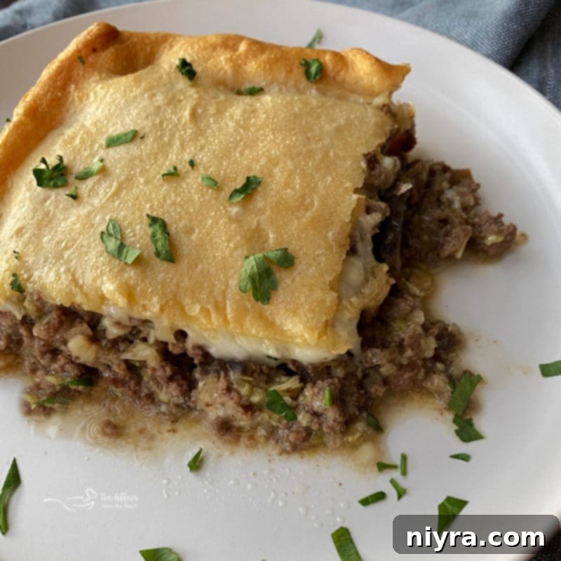 Swiss Mushroom Runza Bake 3 Close-up of baked Runza Casserole, showcasing the golden crust and cheesy filling.