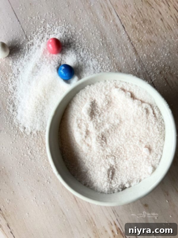 Sugar cookies dusted with pink bubblegum flavored sugar, arranged enticingly.