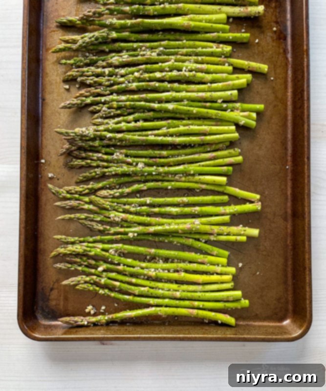 Top view of asparagus on baking sheet