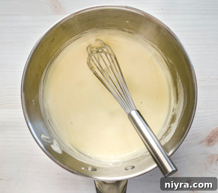 Top view of cheese sauce for garlic cheese asparagus
