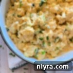 Dorothy's Homemade Potato Salad in a white bowl on a light background