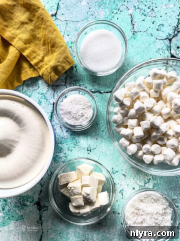 A bowl of thawed Cool Whip and other ingredients laid out for making the pineapple fluff recipe.
