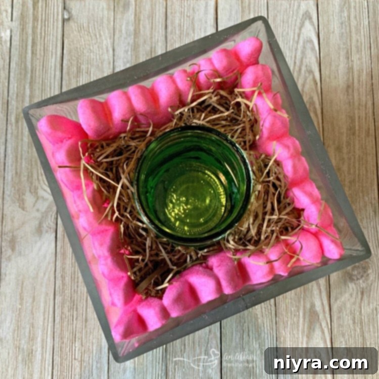 Peep bunnies arranged around a mason jar filled with jelly beans