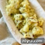 Crispy Roasted Cauliflower 11 overhead of oven roasted cauliflower in a white serving dish