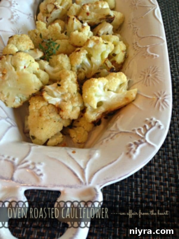 Crispy Roasted Cauliflower 6 Oven roasted cauliflower florets with browned edges in a white bowl.
