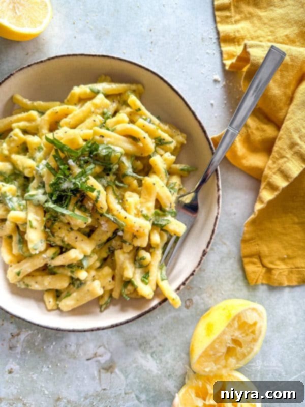 Close-up of Lemon Basil Pasta Salad with a fork