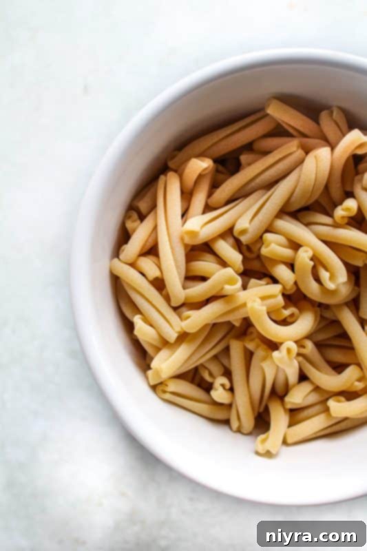 Shredded basil and parmesan cheese for pasta salad