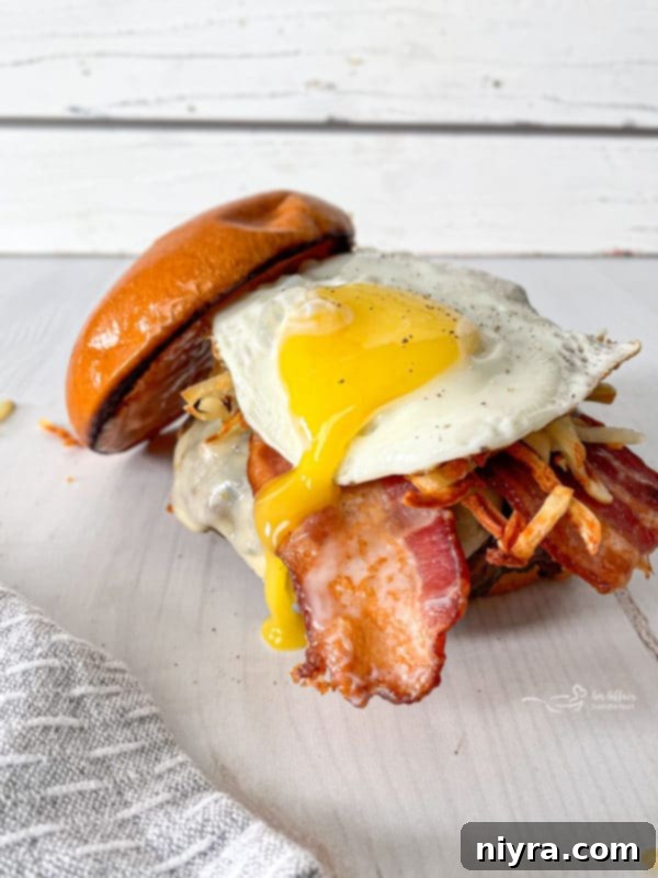 Burger patties grilling, demonstrating the cooking process for a Hangover Burger