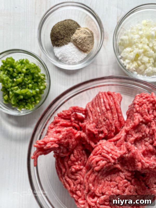 A selection of fresh ingredients for the Hangover Burger laid out on a wooden cutting board