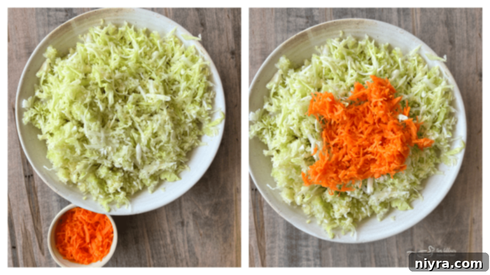 Overhead view of dressing being poured over shredded cabbage and carrots