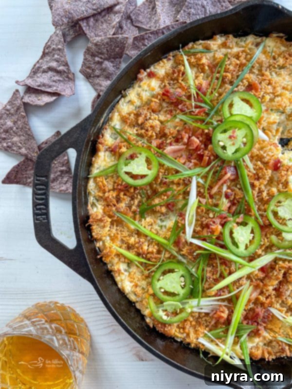 Baked Jalapeño Popper Dip 3 jalapeño popper dip with jalapeño on top