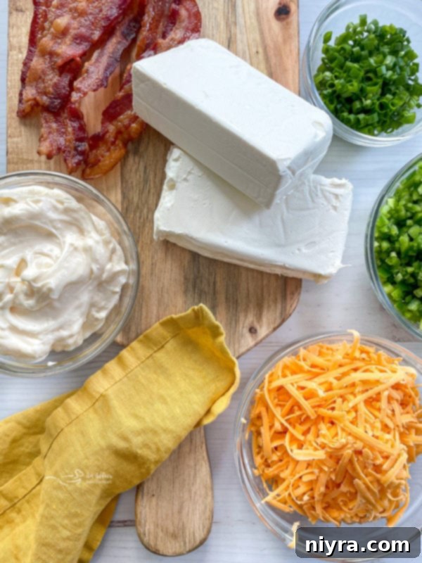 Baked Jalapeño Popper Dip 4 cream cheese, cheddar cheese, sour cream, fresh herbs, green onions, bacon