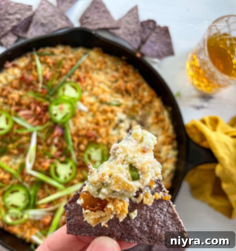 Baked Jalapeño Popper Dip 10 top view of jalapeño popper dip with spoon