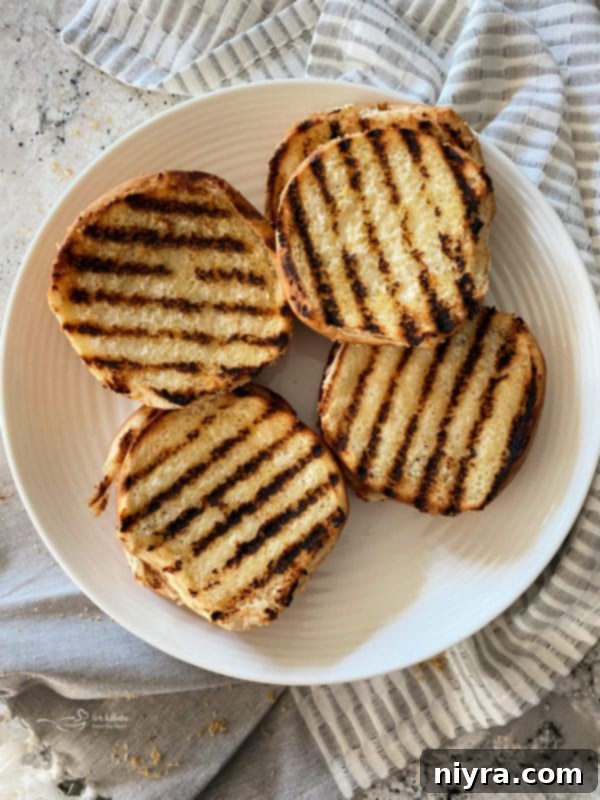 Toasting hamburger buns on the grill