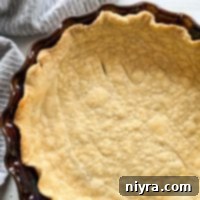pie crust in brown pie plate