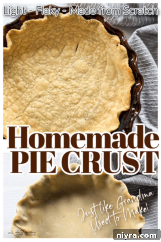 Rustic homemade pie crust in a metal pie dish, with a 'Pin It' overlay.