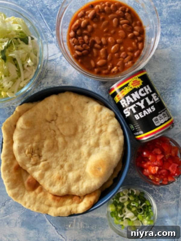 Native American Fry Bread Tacos 9 Ingredients for Indian Tacos displayed on a counter.