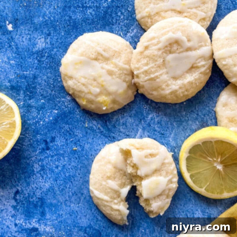 Chewy glazed lemon cookies cooling on a rack