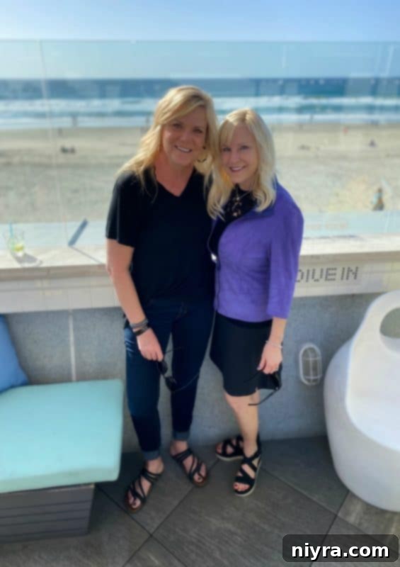 Two women smiling, hinting at a warm friendship