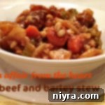 Close up of Beef and Barley stew in a white bowl