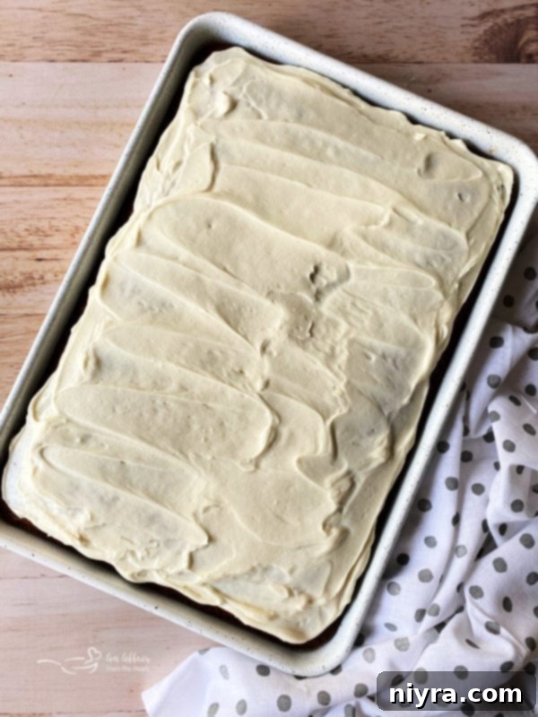 top view of carrot cake bars topped with cream cheese frosting