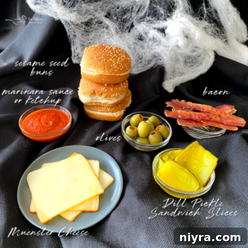 A collection of Halloween Monster Burgers with various spooky toppings arranged artfully.