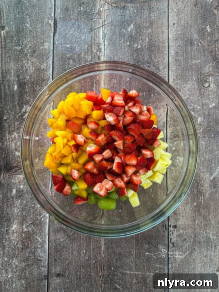 Cubed fresh fruit in a large bowl