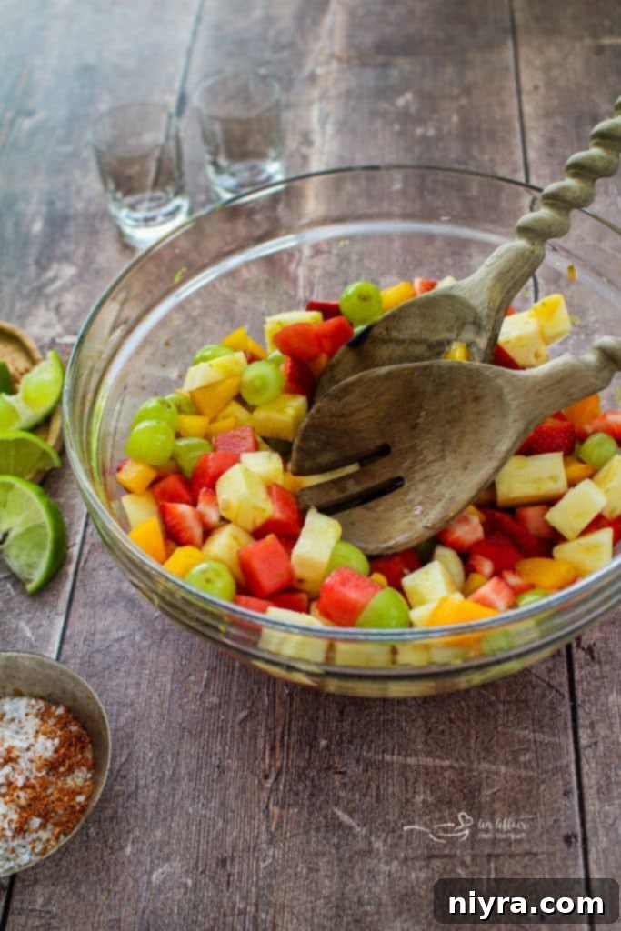 Margarita Lime Dressing poured over fruit salad