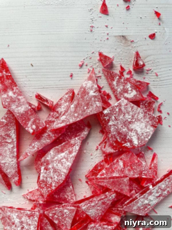 How to Make Cinnamon Rock Candy 12 Top view of pieces of cinnamon rock candy with powdered sugar coating