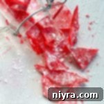 How to Make Cinnamon Rock Candy 19 Cinnamon rock candy broken into tiny pieces in a jar