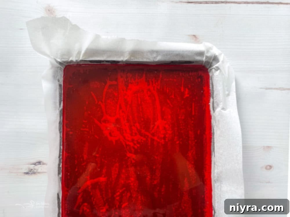 How to Make Cinnamon Rock Candy 8 Top view of cinnamon candy mixture poured into a prepared baking sheet