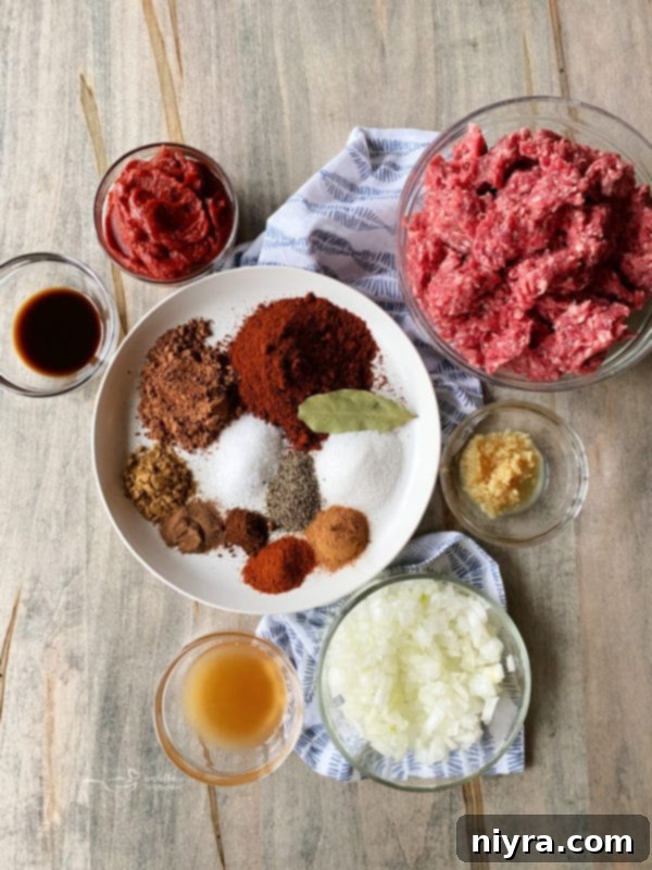 various ingredients in bowls on a table, ready for Cincinnati Chili preparation