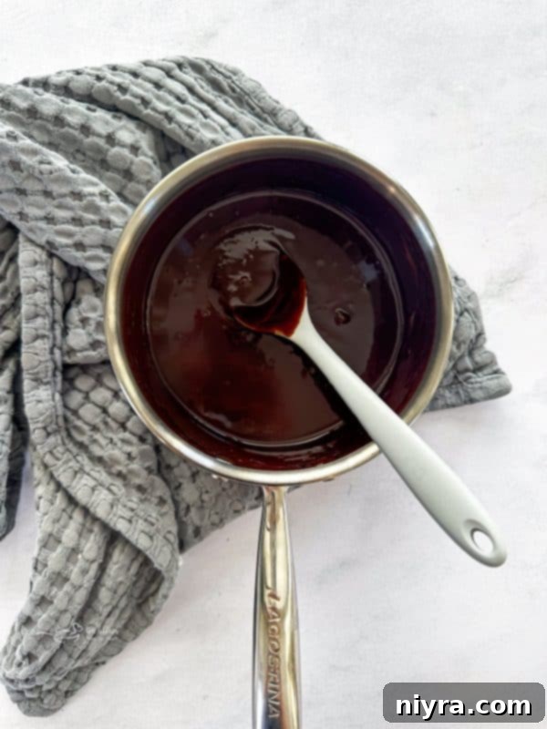 The elegant Chocolate Espresso Bundt Cake, perfectly inverted onto a cooling rack, showcasing its beautiful shape.