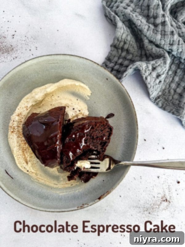 A beautifully sliced Chocolate Espresso Bundt Cake, showcasing its moist interior, rich ganache, and delicate whipped cream.