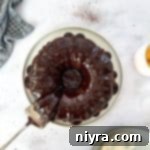 Chocolate Espresso cake and a cake server on a white plate.