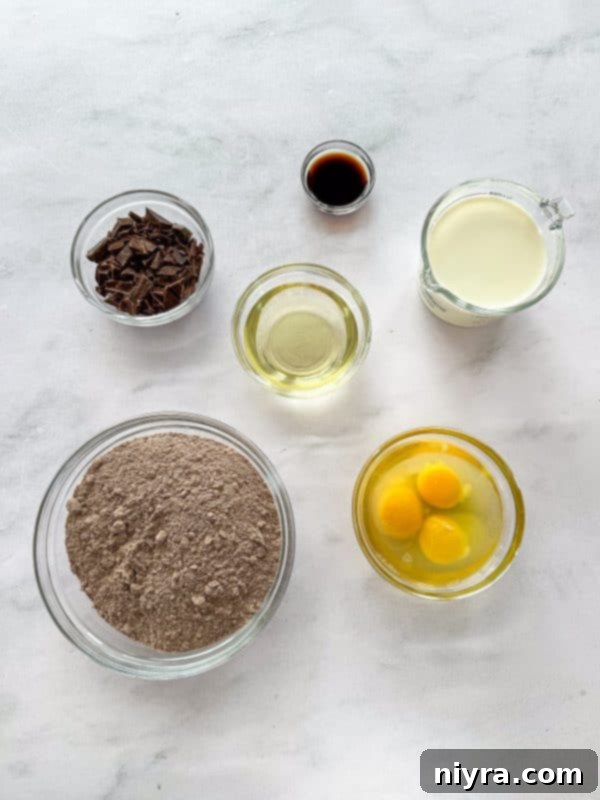 A selection of high-quality ingredients laid out for baking a chocolate espresso cake, emphasizing freshness and readiness.