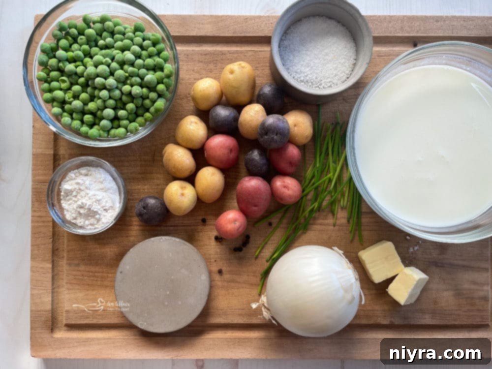 Individual ingredients for creamed potatoes and peas: fresh chives, salt, milk, onion, flour, butter, peas, and potatoes.