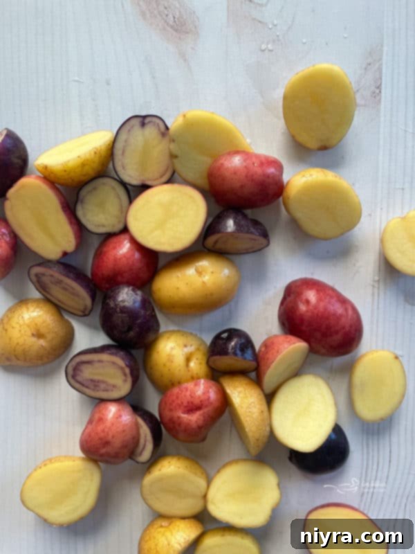 Halved and cleaned new potatoes, ready for cooking.