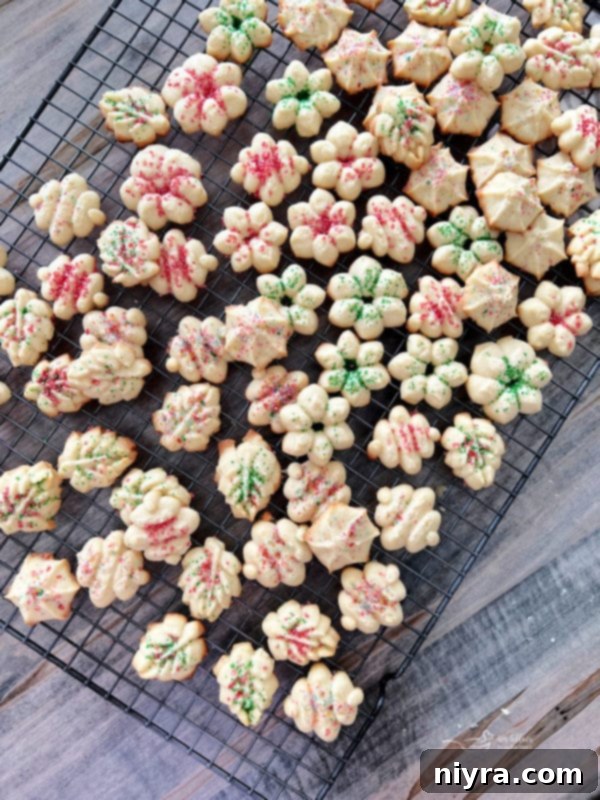 baked spritz cookies on wire rack