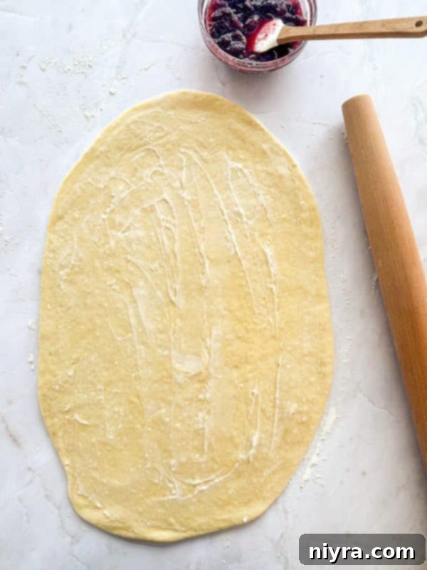 Zesty Cherry Limeade Sweet Rolls 11 The cherry limeade filling spread evenly over the rolled-out dough.