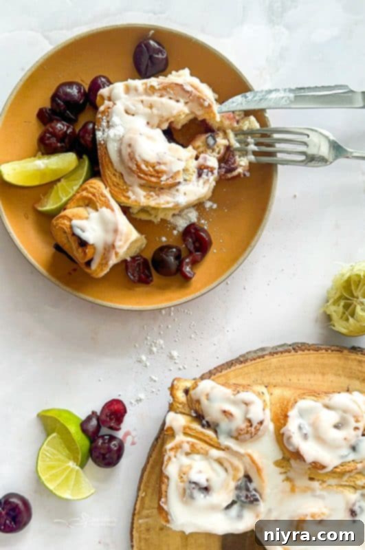 Zesty Cherry Limeade Sweet Rolls 18 A close-up shot of a plate of iced Cherry Limeade Sweet Rolls, ready to be enjoyed.