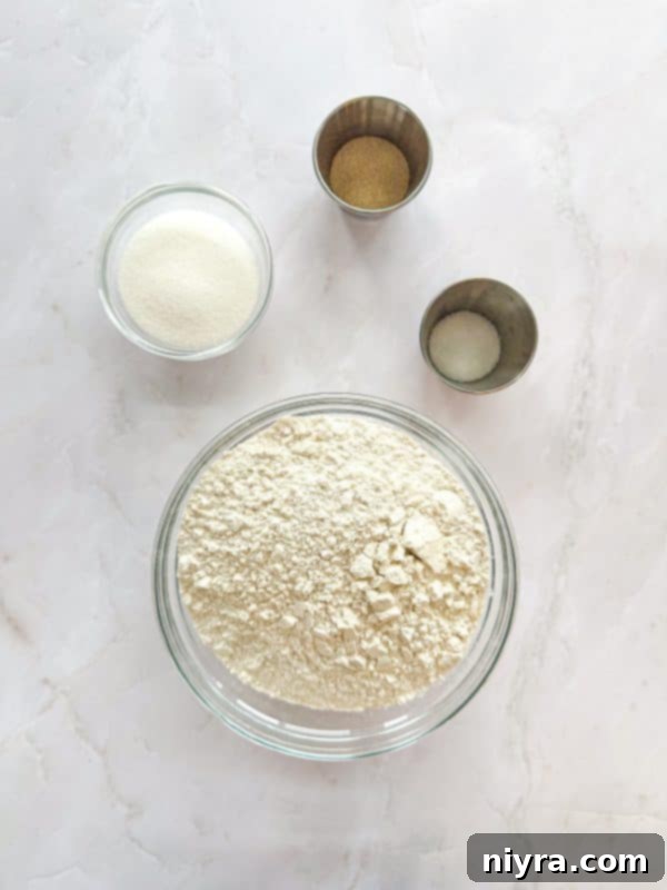 Zesty Cherry Limeade Sweet Rolls 6 Ingredients for Cherry Limeade Sweet Rolls laid out on a table, including flour, sugar, cherries, and limes.