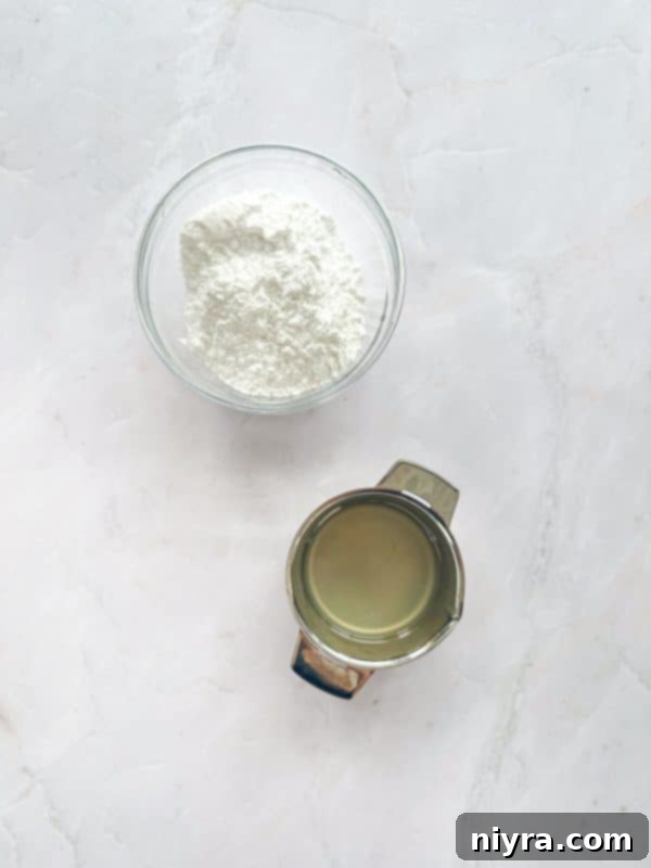 Zesty Cherry Limeade Sweet Rolls 8 A small bowl of powdered sugar and a half-cut lime, ready for making the icing.