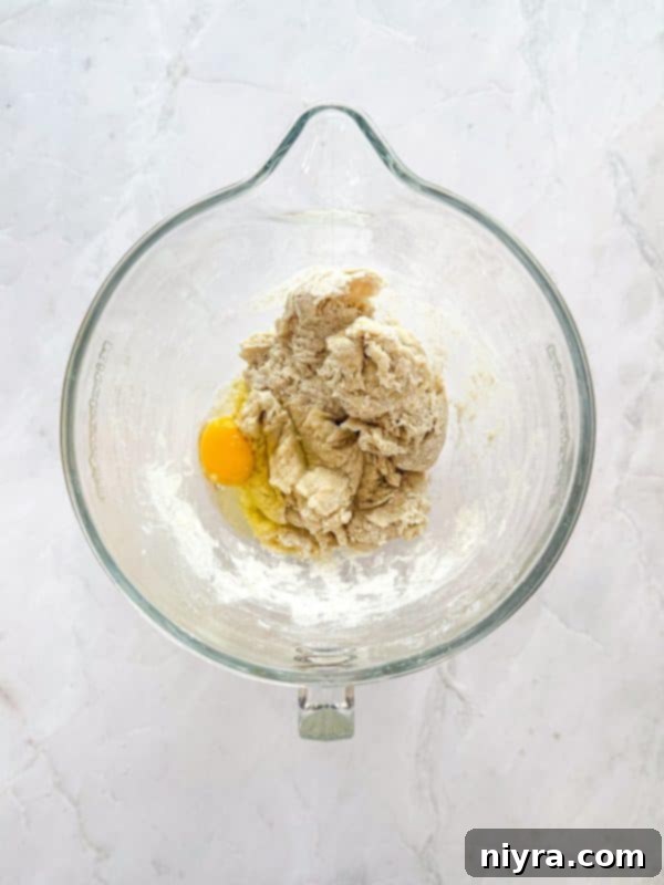 Zesty Cherry Limeade Sweet Rolls 9 A stand mixer bowl with dry ingredients for dough, ready for liquid addition.